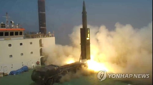 In this file photo provided by the Ministry of Defense on June 23, 2017, Hyunmoo-2, a new homegrown ballistic missile with a range of 800 kilometers, is test-fired from a mobile launch pad at a test site of the Agency for Defense Development in Anheung, 200 kilometers southwest of Seoul, the same day with President Moon Jae-in on hand. (Yonhap)