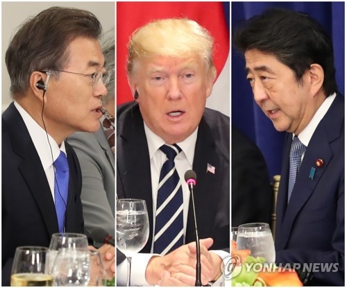 This compilation of photos shows South Korean President Moon Jae-in (L), U.S. President Donald Trump (C) and Japanese Prime Minister Shinzo Abe speaking at a trilateral luncheon meeting in New York on Sept. 21, 2017. (Yonhap)
