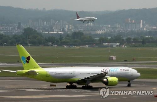 This file photo shows a Jin Air B777-200 passenger jet. (Yonhap)