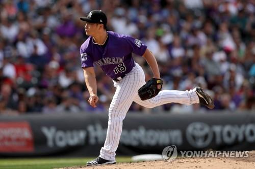 In this Getty Images photo, Oh Seung-hwan of the Colorado Rockies throws a pitch against the Philadelphia Phillies in the top of the seventh inning of a Major League Baseball regular season game at Coors Field in Denver on Sept. 27, 2018. (Yonhap)