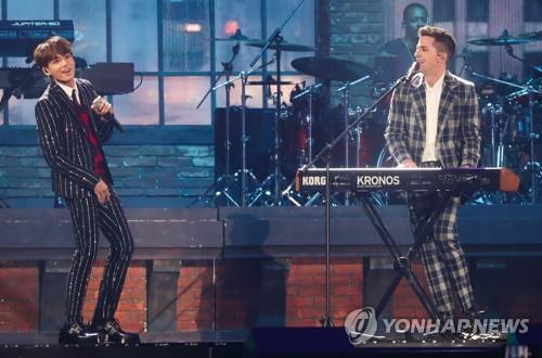 BTS performs with American singer-songwriter Charlie Puth during the 2018 MBC Plus X Genie Music Awards in Incheon, west of Seoul, on Nov. 6, 2018. (Yonhap)