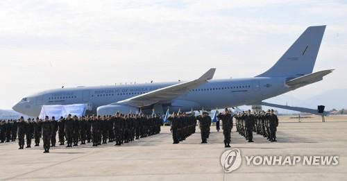 In the file photo taken Jan. 30, 2019, members of an Air Force unit salute during a ceremony at an air base in the southeastern city of Gimhae to mark the introduction of a KC-330 aerial tanker, the country's first aerial refueling aircraft, before its deployment in 2020. (Yonhap)