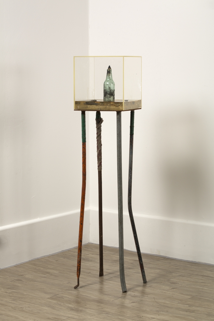 This image provided by the Hakgojae gallery in Seoul shows Shin Kyung-ho's found object sculpture "Molotov Cocktail - Against the Dictator" (1992) on display at the "Art and Words 2020" exhibition at the gallery. (PHOTO NOT FOR SALE) (Yonhap)