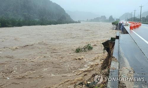Part of a road in Gangwon Province, east of Seoul, is destroyed due to Typhoon Haishen on Sept. 7, 2020, in this photo provided by the Yangyang County Office. (PHOTO NOT FOR SALE) (Yonhap)