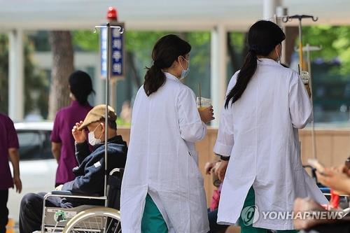 This photo taken on April 18, 2024, shows doctors and a patient at a university hospital in Seoul amid a prolonged walkout by trainee doctors. (Yonhap)