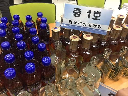 범행에 쓰인 양주.