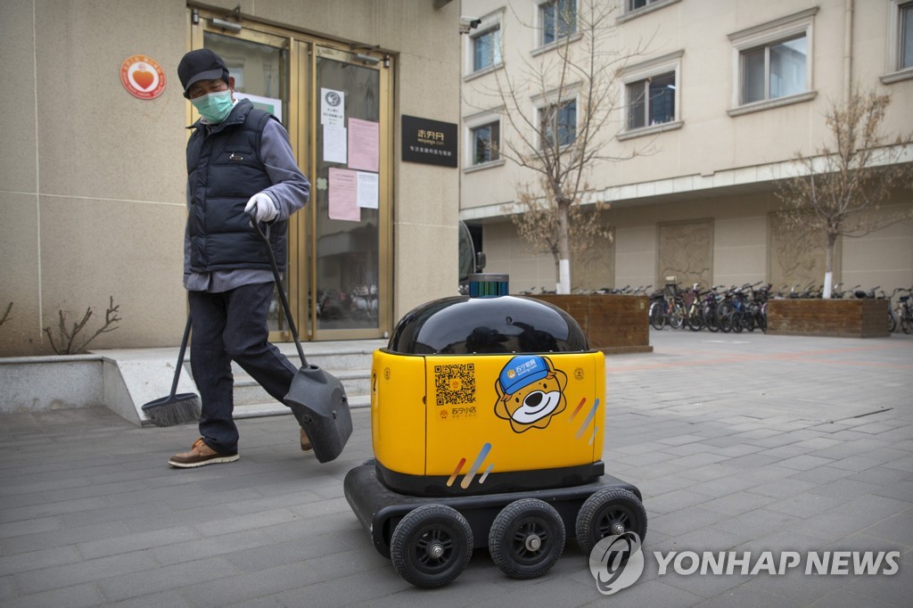 Virus Outbreak China Robot Maker