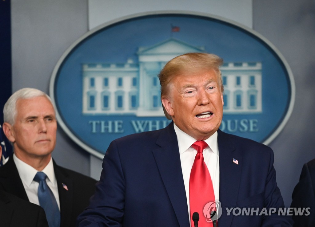 This AFP photo shows U.S. President Donald Trump speaking during a press conference on the coronavirus as U.S. Vice President Mike Pence looks on at the White House in Washington on February 29, 2020. (Yonhap)