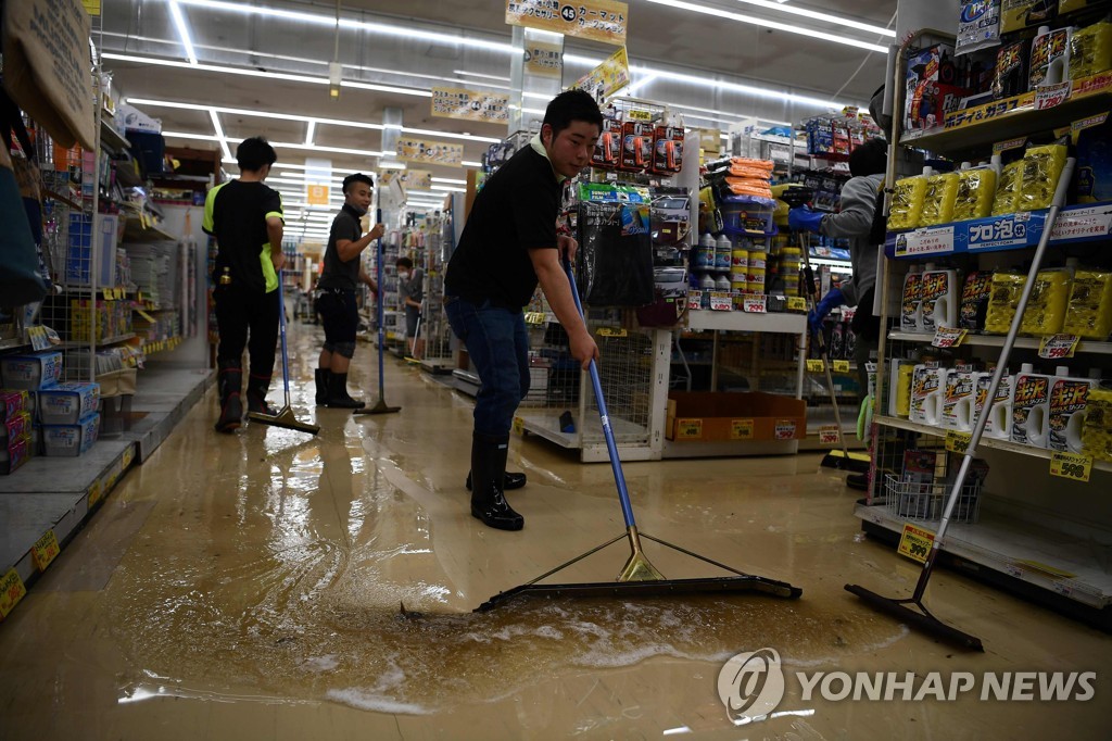 TOPSHOT-CORRECTION-JAPAN-WEATHER-RAIN-FLOOD