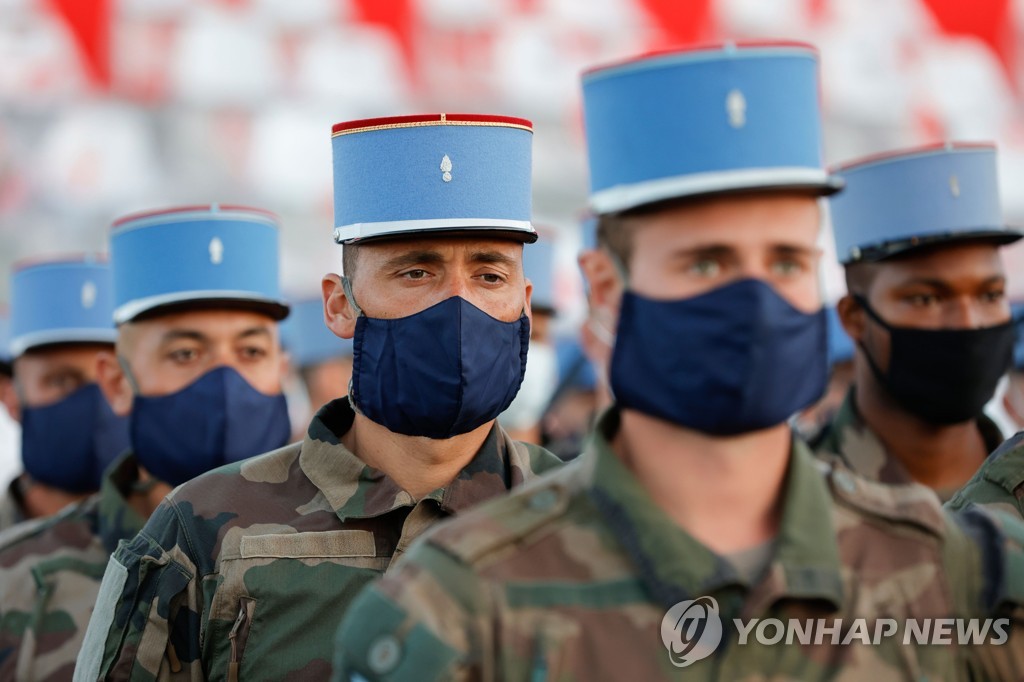 TOPSHOT-FRANCE-HEALTH-VIRUS-PARADE-BASTILLE-DAY
