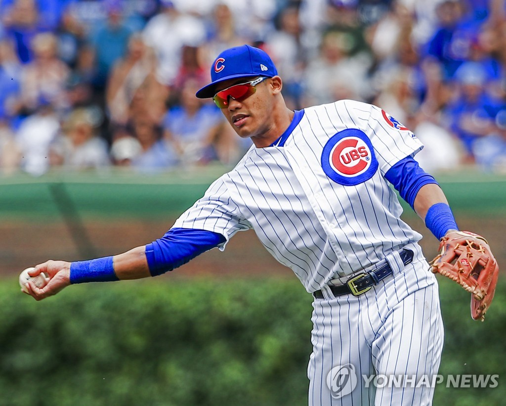 In this EPA file photo, from June 21, 2019, Chicago Cubs' second baseman Addison Russell makes a throw to first base during the bottom of the first inning of a Major League Baseball regular season game against the New York Mets at Wrigley Field in Chicago. (Yonhap)
