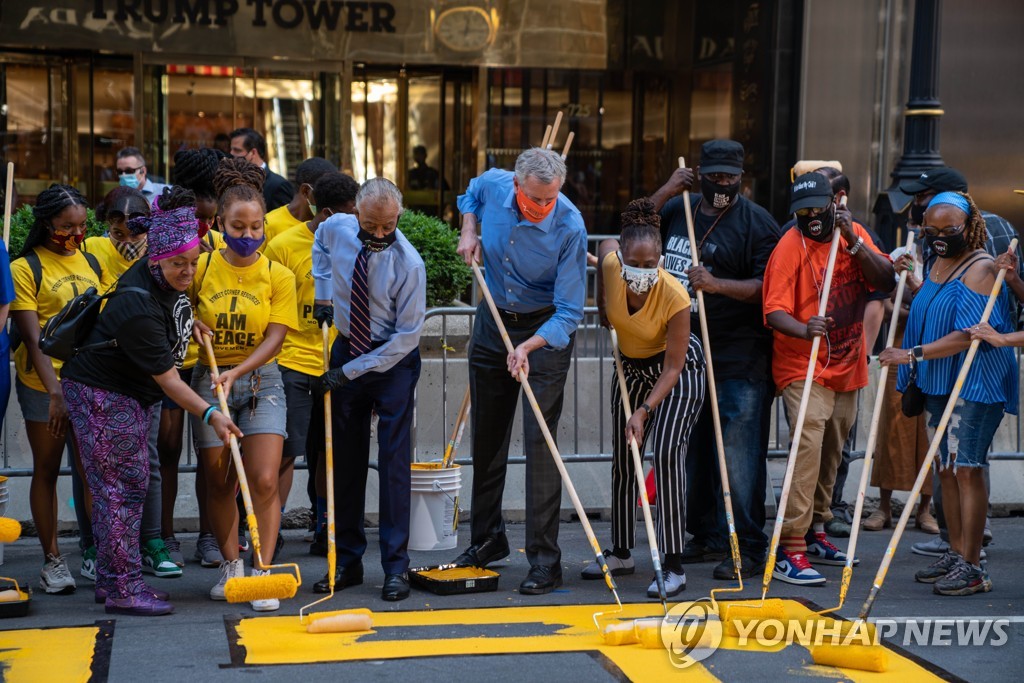 US-BLACK-LIVES-MATTER-MURAL-PAINTED-ON-STREET-IN-FRONT-OF-TRUMP-