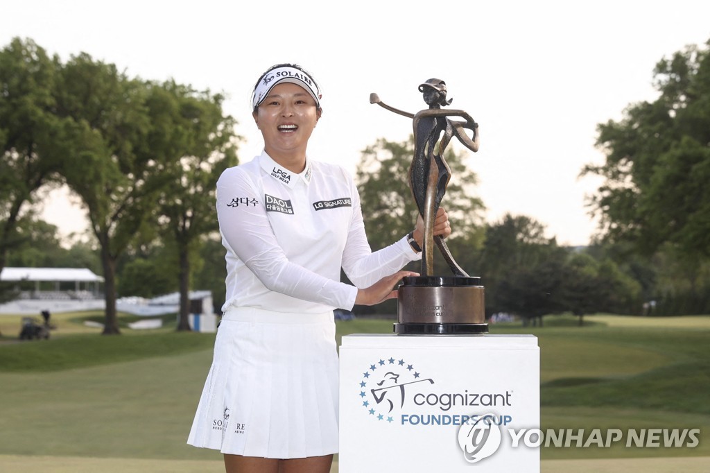 In this Getty Images photo, Ko Jin-young of South Korea celebrates with the champion's trophy after winning the Cognizant Founders Cup on the LPGA Tour at Upper Montclair Country Club in Clifton, New Jersey, on May 14, 2023. (Yonhap)