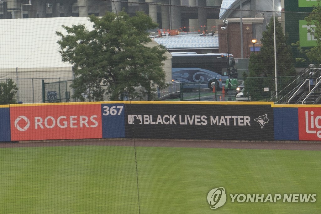 In this USA Today Sports photo via Reuters, the outfield wall at Sahlen Field in Buffalo, New York, displays the slogan "Black Lives Matter" prior to a Major League Baseball regular season game between the home team Toronto Blue Jays and the Boston Red Sox on Aug. 27, 2020. The game was postponed in the clubs' protest to a recent police shooting of a black man in Wisconsin. (Yonhap)