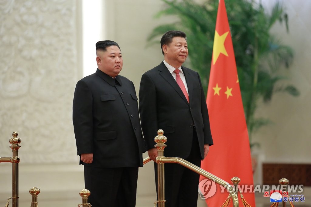 This photo, published by the North's Korean Central News Agency on Jan. 10, 2019, shows North Korean leader Kim Jong-un (L) and Chinese President Xi Jinping in Beijing on Jan. 8. (For Use Only in the Republic of Korea. No Redistribution.) (Yonhap)