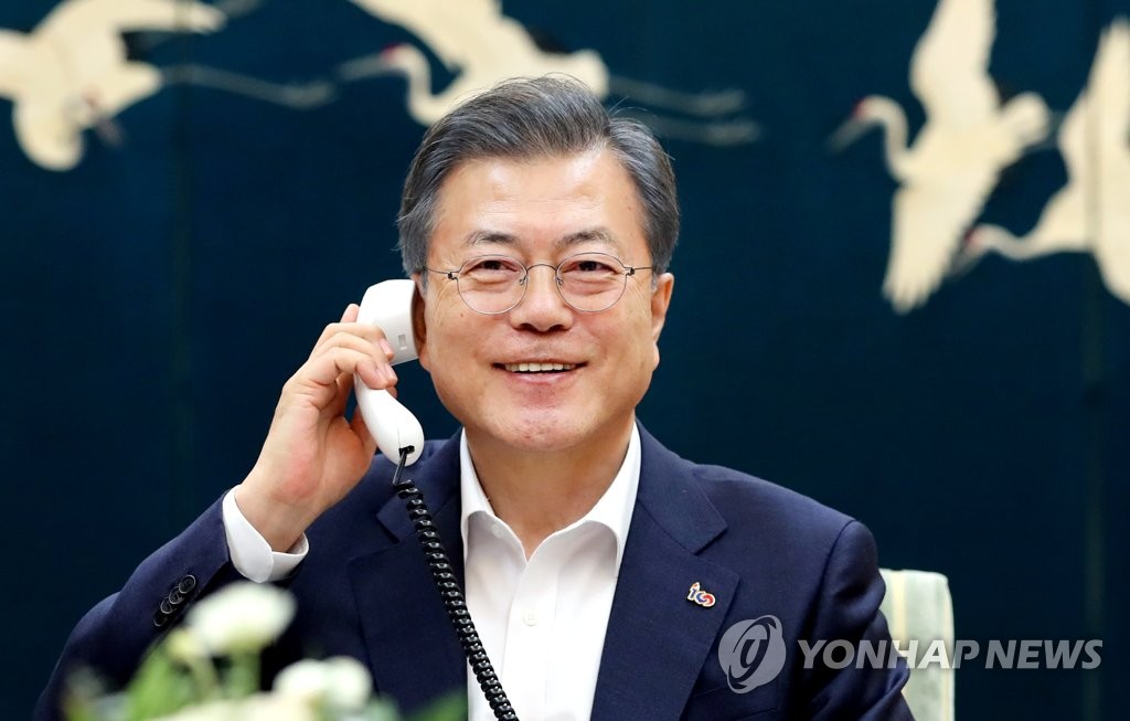 In this photo provided by South Korea's presidential office Cheong Wa Dae, South Korean President Moon Jae-in holds a telephone conversation with U.S. President Donald Trump on Feb. 19, 2019. (Yonhap)