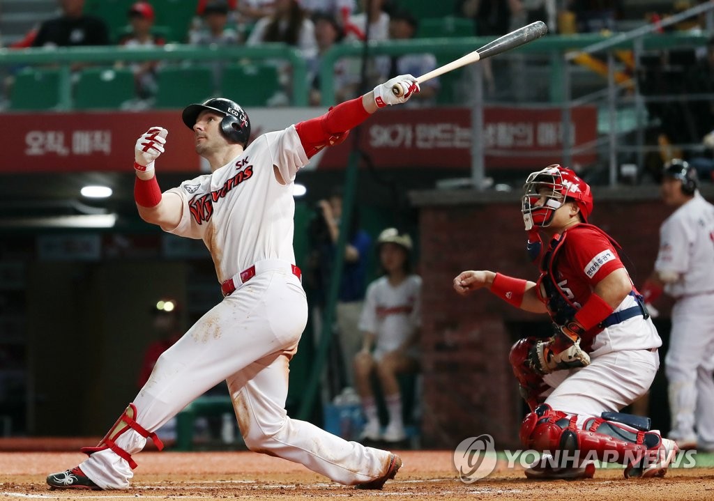 In this file photo from Aug. 1, 2019, Jamie Romak of the SK Wyverns hits a solo home run against the Kia Tigers in the bottom of the seventh inning of a Korea Baseball Organization regular season game at SK Happy Dream Park in Incheon, 40 kilometers west of Seoul. (Yonhap)