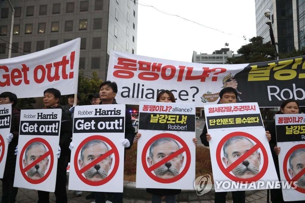 Rally against increasing share of defense costs Rally against increasing share of defense costs
