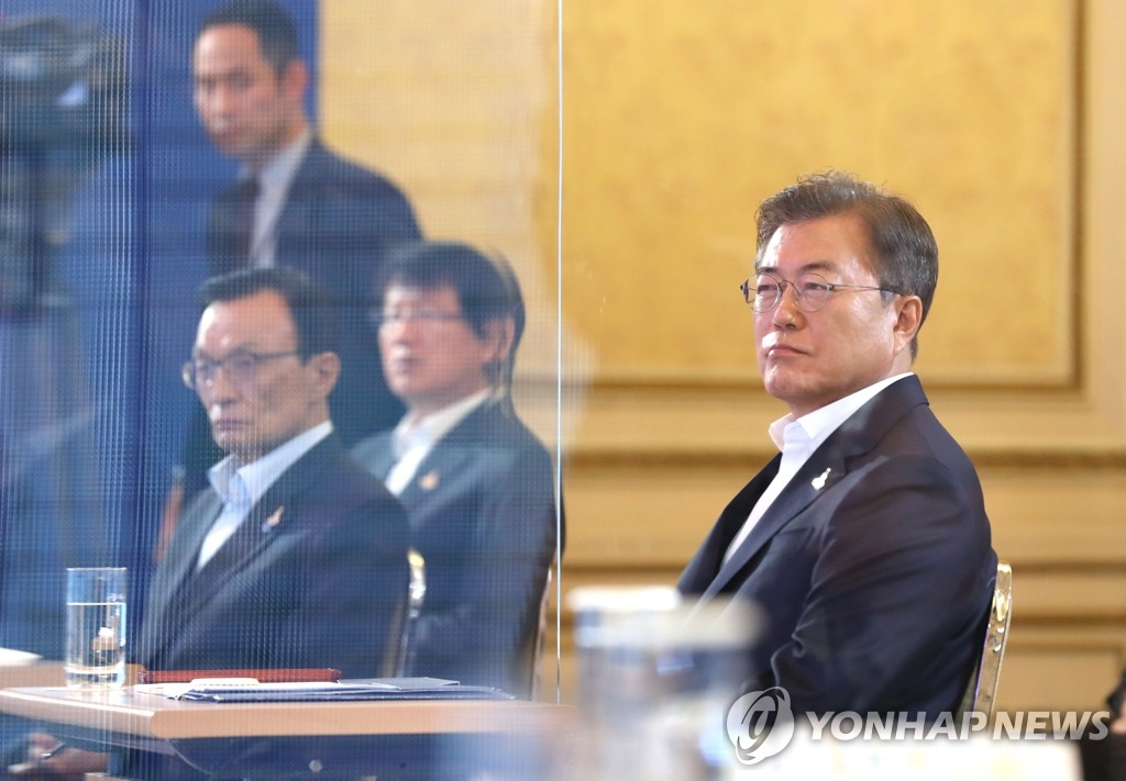 President Moon Jae-in (R) attends a Cheong Wa Dae event in Seoul to unveil details of his New Deal initiative on July 14, 2020. (Yonhap)