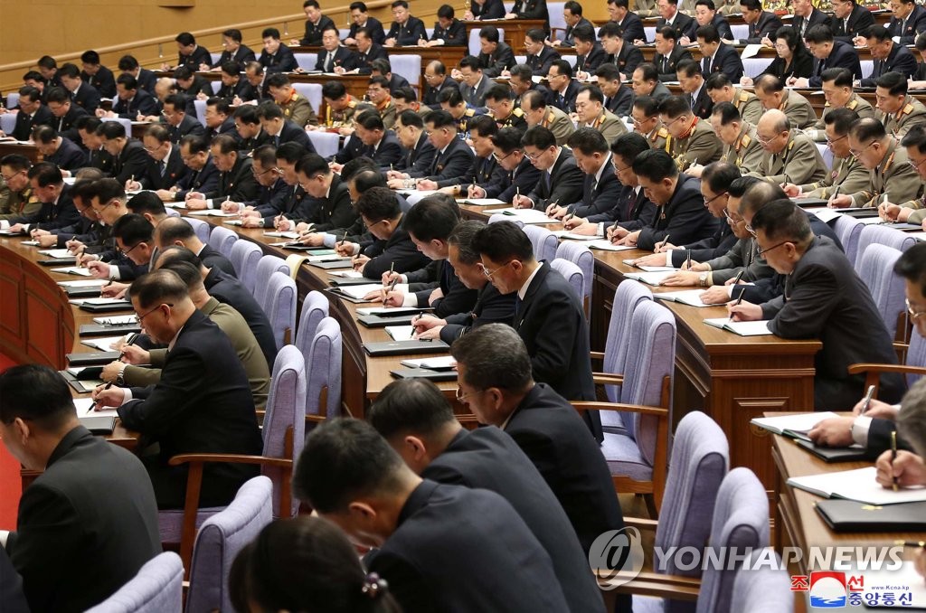 Participants take notes on North Korean leader Kim Jong-un's remarks during the second plenary meeting of the central committee of North Korea's Workers' Party in Pyongyang on Feb. 8, 2021, in this photo released by Korean Central News Agency. The meeting discussed details to put into practice a new five-year economic development plan set forth at the party's eighth congress the previous month. (For Use Only in the Republic of Korea. No Redistribution) (Yonhap)