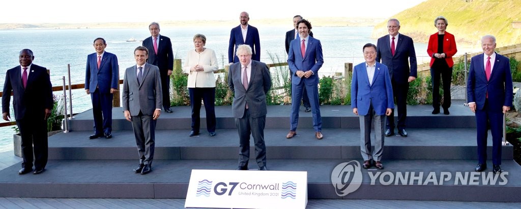 South Korean President Moon Jae-in (2nd from R, first row) poses for a picture with leaders attending the Group of Seven (G-7) summit in Carbis Bay, Cornwall, Britain, on June 12, 2021. From left to right in front are South African President Cyril Ramaphosa, French President Emmanuel Macron, British Prime Minister Boris Johnson, Moon and U.S. President Joe Biden. From left in the second row are Japanese Prime Minister Yoshihide Suga, German Chancellor Angela Merkel, Canadian Prime Minister Justin Trudeau and Australian Prime Minister Scott Morrison. From left in the third row are United Nations Secretary-General Antonio Guterres, European Council President Charles Michel, Italian Prime Minister Mario Draghi and European Commission President Ursula von der Leyen.