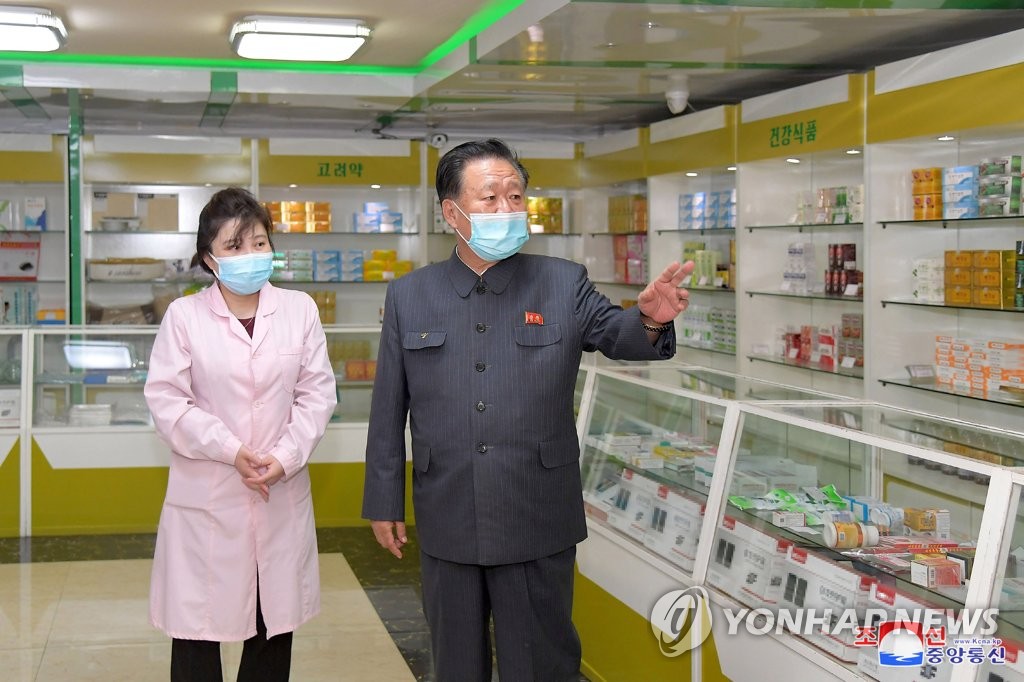 Choe Ryong-hae (C), chairman of North Korea's Supreme People's Assembly's standing committee, inspects a pharmacy in Pyongyang amid the COVID-19 outbreak, in this undated photo released May 17, 2022, by the North's official Korean Central News Agency. The military medical field of the People's Army has been mobilized to supply medicine to pharmacies under the 24-hour service system, as the North has seen a surge in suspected coronavirus cases. (For Use Only in the Republic of Korea. No Redistribution) (Yonhap)