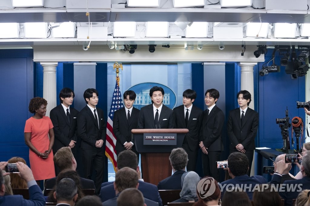 This photo, provided by Hybe, shows the members of K-pop sensation BTS speaking at the briefing room of the White House in Washington on May 31, 2022, prior to their meeting with U.S. President Joe Biden to discuss anti-Asian hate crimes. (PHOTO NOT FOR SALE) (Yonhap)