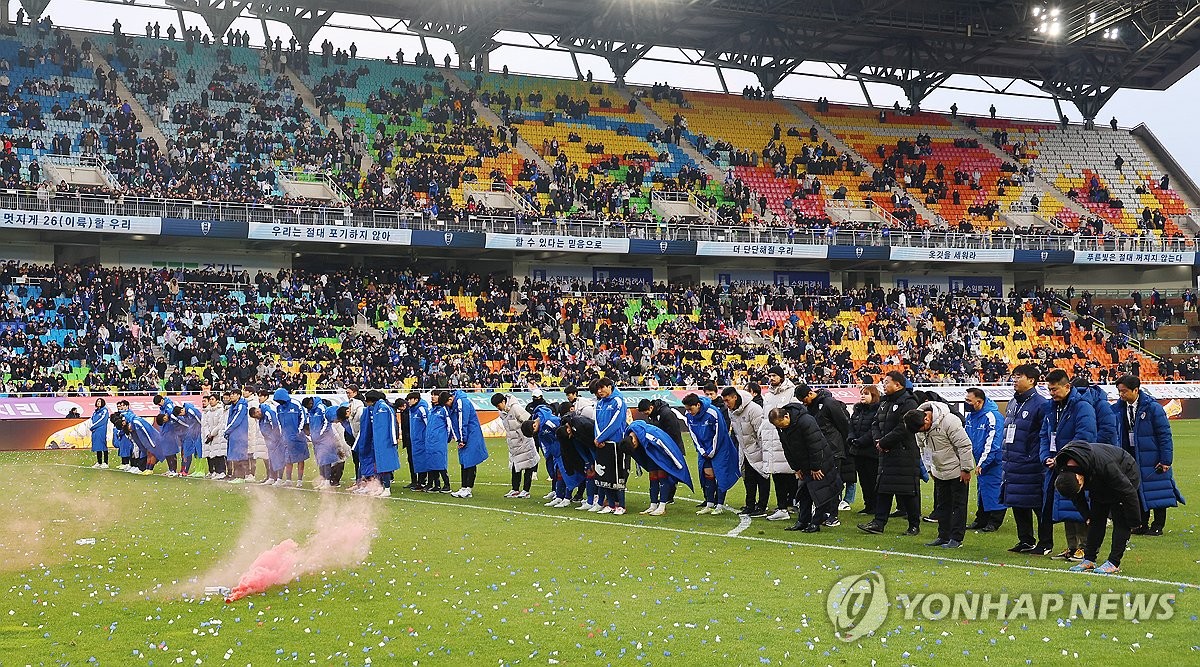 Suwon Samsung Bluewings players apologize to their supporters at Suwon World Cup Stadium in Suwon, Gyeonggi Province, after suffering direct relegation from the K League 1 to K League 2 following a goalless draw against Gangwon FC on Dec. 2, 2023. (Yonhap)