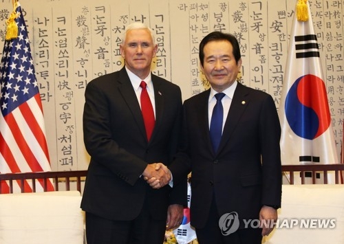 South Korea's National Assembly Speaker Chung Sye-kyun (R) shakes hands with U.S. Vice President Mike Pence before their talks at the Assembly in Seoul on April 17, 2017. (Pool photo) (Yonhap)