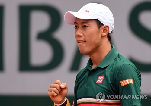 In this EPA photo, Kei Nishikori of Japan reacts after beating Chung Hyeon of South Korea in the third round at the French Open at Roland Garros, Paris, on June 4, 2017. (Yonhap)