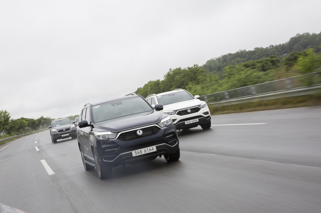 In this photo taken on June 7, 2017, SsangYong Motor's G4 Rexton SUVs drive along a motorway during a media test-drive event. (Yonhap)