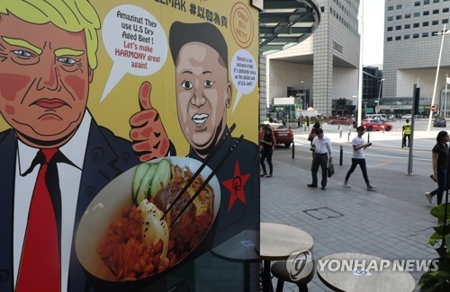 A local restaurant in Singapore launches a new menu item -- a bowl of rice and beef with kimchi -- on June 6, 2018, to mark the historic U.S.-North Korea summit slated for June 12. (Yonhap)