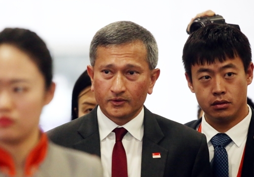 Singaporean Foreign Minister Vivian Balakrishnan enters the departure terminal at Beijing's International Airport to take a flight to Pyongyang for a two-day visit on June 7, 2018. (Yonhap)