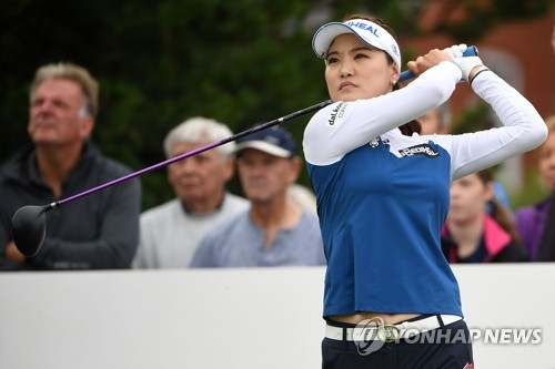In this AFP photo from Aug. 4, 2018, Ryu So-yeon of South Korea watches her tee shot at the second hole during the third round of the Ricoh Women's British Open at Royal Lytham & St. Annes Golf Club in Lancashire, England. (Yonhap)