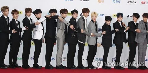 Seventeen members pose for photos at a red carpet event for SBS' 2018 Music Awards Festival on Dec. 25, 2018. (Yonhap)