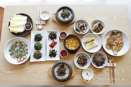 This image, provided by the Korea Tourism Organization, shows a typical Korean cuisine table arrangement for two people. (PHOTO NOT FOR SALE) (Yonhap)