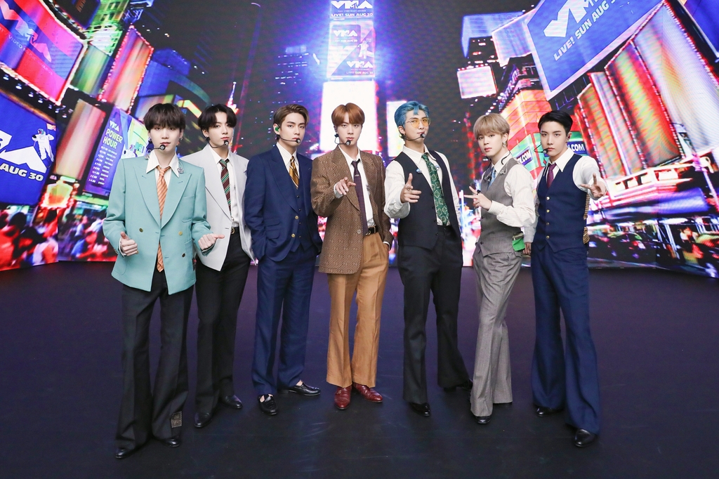 This photo provided by Big Hit Entertainment on Aug. 31, 2020, shows K-pop band BTS posing for photos ahead of a recent shooting of a performance for "Dynamite" aired on the 2020 MTV Music Video Awards. (PHOTO NOT FOR SALE) (Yonhap)