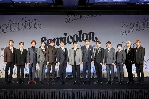 This photo provided by Pledis Entertainment on Oct. 19, 2020, shows members of K-pop group Seventeen posing for photos during an online showcase held at Coex Inter-Continental Hotel in southern Seoul. (PHOTO NOT FOR SALE) (Yonhap)