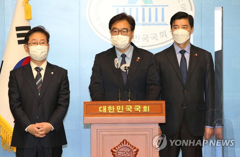 Officials of the ruling Democratic Party's task force for relocating the administrative capital to Sejong speak during a briefing at the National Assembly in Seoul on Dec. 9, 2020. (Yonhap)