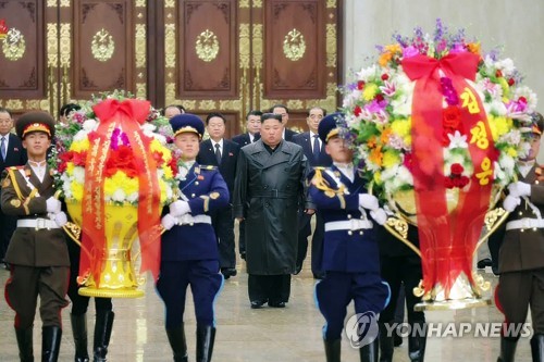 In this photo captured from the North's Korean Central TV Broadcasting Station on Feb. 16, 2020, North Korean leader Kim Jong-un (C) enters the Kumsusan Palace of the Sun to pay tribute to his late father and former leader, Kim Jong-il. (For Use Only in the Republic of Korea. No Redistribution) (Yonhap)
