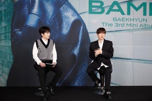 In this photo provided by SM Entertainment, Baekhyun (R), a member of K-pop boy band EXO, speaks at an online press conference on his new solo EP "Bambi" on March 30, 2021. (PHOTO NOT FOR SALE) (Yonhap)