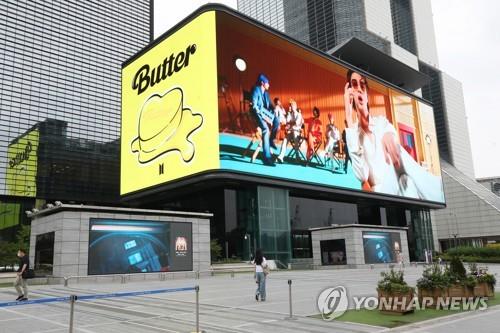 This June 15, 2021, photo shows the BTS music video "Butter" playing in southern Seoul. (Yonhap)