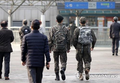 In the Nov. 1, 2021, file photo, soldiers walk outside Seoul Station on the first day of the "living with COVID-19" measures that South Korea has adopted to phase out coronavirus restrictions and reopen the economy amid rising vaccination levels. (Yonhap)