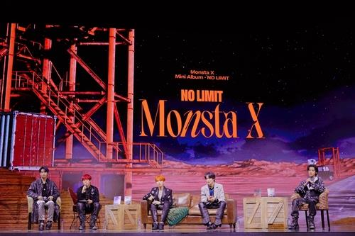 This photo provided by Starship Entertainment shows boy band Monsta X attending a media showcase for the group's new mini album "No Limit" streamed online on Nov. 19, 2021. (PHOTO NOT FOR SALE) (Yonhap)