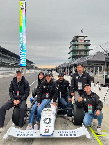 The photo provided by the Korea Advanced Institute of Science and Technology (KAIST) on Dec. 9, 2021, shows members of the Unmanned Systems Research Group when they participated in the Indy Autonomous Challenge (IAC), which took place on the Indianapolis Motor Speedway in Indiana on Oct. 23, 2021. (PHOTO NOT FOR SALE) (Yonhap)