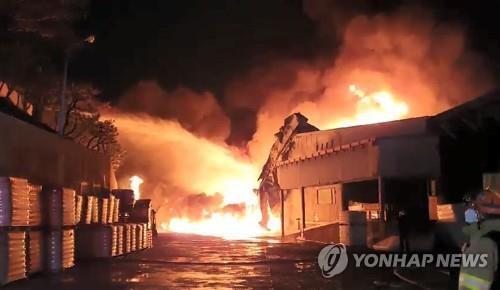 This Jan. 24, 2022, photo provided by Ulsan Fire Department shows a fire that broke out at a synthetic fiber manufacturing factory of Hyosung TNC Corp. in the southeastern city of Ulsan the previous day.