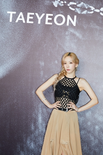 K-pop singer Taeyeon poses for photographers during an online press conference for her third full album "INVU" on Feb. 14, 2022, in this image provided by SM Entertainment. (Yonhap)
