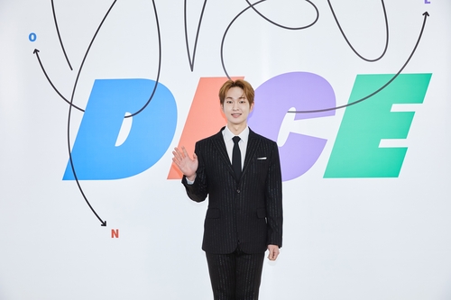SHINee's Onew poses for photographers during an online news conference for his second individual EP "Dice" on April 11, 2022, in this photo provided by SM Entertainment. (PHOTO NOT FOR SALE) (Yonhap)