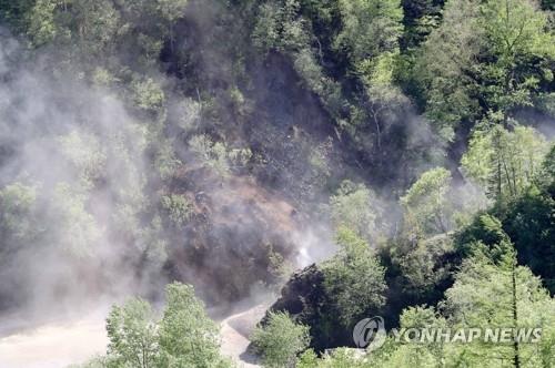 This file photo, taken May 24, 2018, shows detonation work at Punggye-ri nuclear test site in North Korea. (Pool photo) (Yonhap)