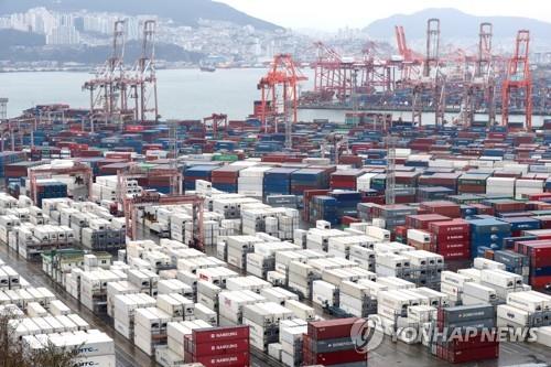 Containers are stacked at a port in the southeastern city of Busan on March 1, 2023. (Yonhap)